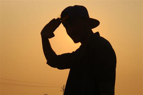 1366x768 wallpaper | silhouette of man wearing fitted cap | Peakpx