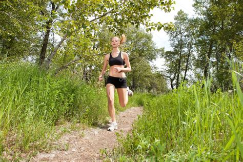 Woman jogging in a park — Stock Photo © SimpleFoto #5709309