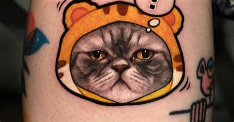 Persian cat portrait tattoo located on the calf.