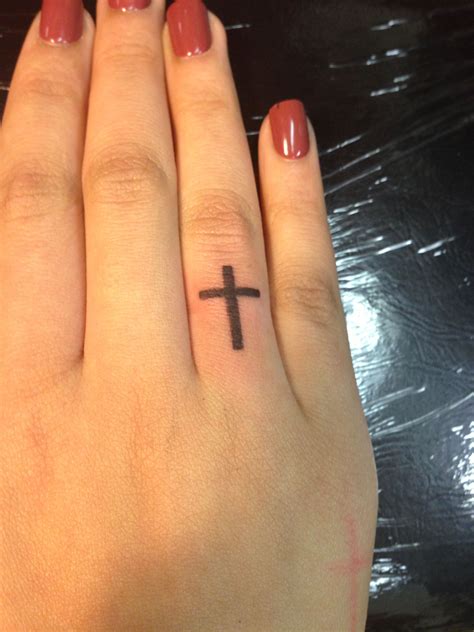 Ring Finger Cross Tattoos