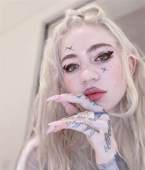 Grimes Debuts New Gnarly White-Ink “Alien Scars” Full Back Tattoo