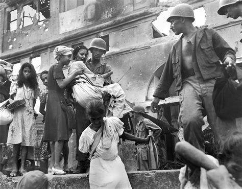 Filipino women rescued by American soldiers, Intramuros, Manila, Philippines, March 1945 ...