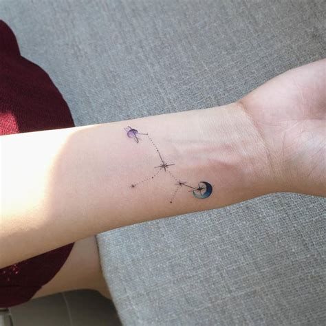 Virgo constellation tattoo on the inner wrist.