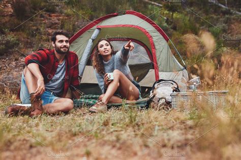 Young couple camping in nature | High-Quality People Images ~ Creative Market