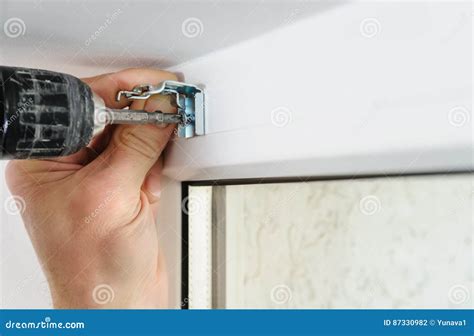 Installing wooden blinds. stock photo. Image of braket - 87330982