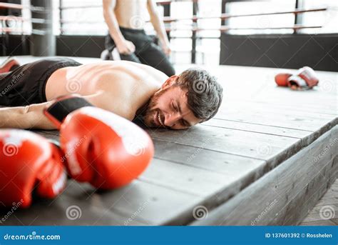 Boxer Falling on the Floor during a Boxing Battle Stock Photo - Image of falling, beaten: 137601392