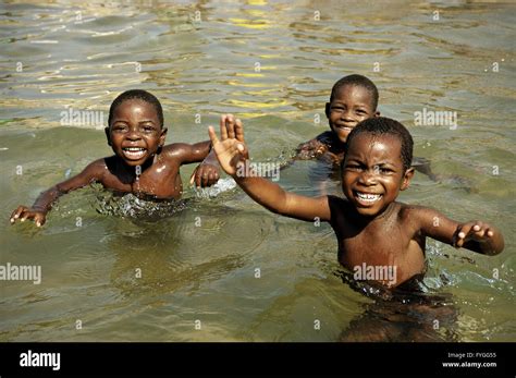 Happy kids swimming in Lake Malawi at Cape Maclear, village of Chembe Stock Photo, Royalty Free ...