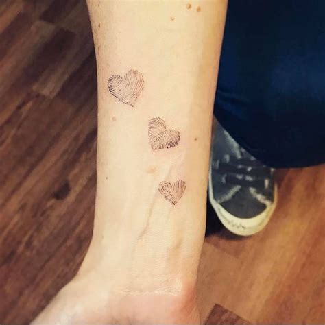 Family fingerprints tattoo on the inner forearm. | Fingerprint tattoos, Fingerprint heart ...