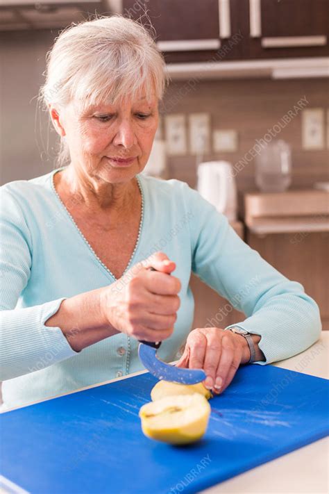 Woman using an ergonomic knife - Stock Image - C034/7726 - Science ...