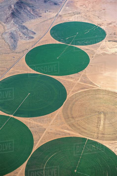 Aerial view of farm land in rural landscape - Stock Photo - Dissolve