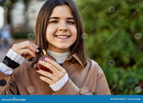 Young Beautiful Brunette Woman Smiling Happy Applying Fragance from Luxury Perfume Stock Photo ...