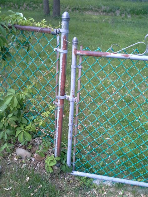 How can I fill in the gap between my chain-link fence and its gate - Home Improvement Stack Exchange
