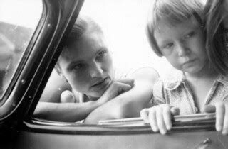 Woman and child looking into a car window | Title: Woman and… | Flickr