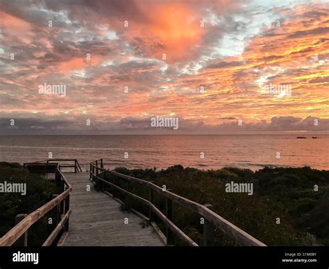 Sunset at Perth beach from wooden walkway and lookout Stock Photo - Alamy