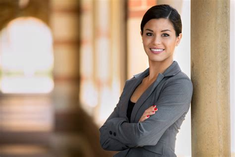 Beautiful young adult lawyer business woman professional in a suit at the courthouse - Ellis