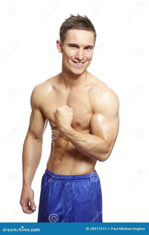 Muscular Young Man Flexing Arm Muscles in Sports Outfit Stock Photo - Image of lifestyles ...