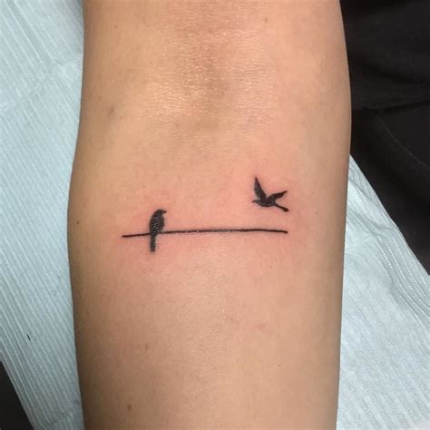 Simple Bird Outline Tattoo