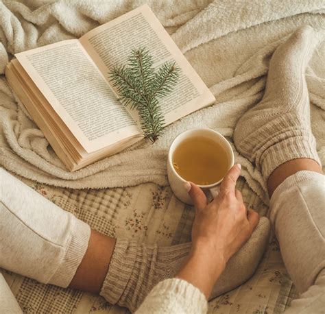 Premium Photo | Cozy winter evening , warm woolen socks. woman is lying feet up on white shaggy ...