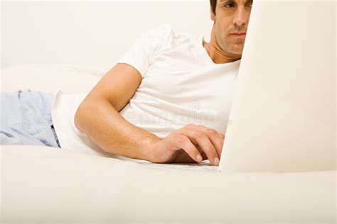 Man on Bed Using Laptop Computer Stock Image - Image of bedroom, latino: 62562773