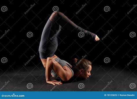 Yoga scorpion pose stock image. Image of portrait, pose - 78125825