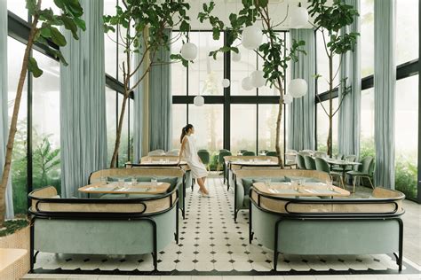 GamFratesi creates plant-filled interiors for Harlan + Holden Glasshouse Cafe in Manila - Dr ...
