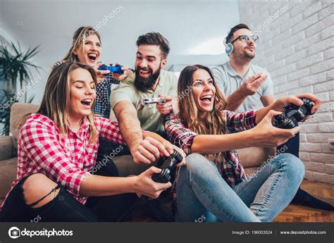 Group Friends Playing Video Games Together Home Stock Photo by ©adriaticphoto 196003524