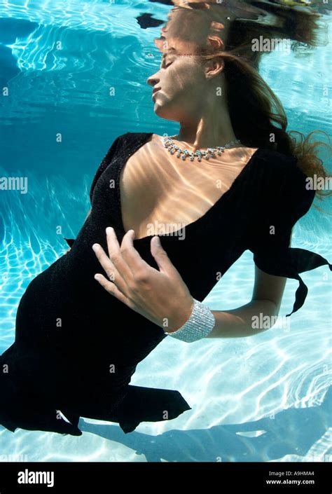 Woman in fashion clothing underwater in swimming pool Stock Photo: 4038819 - Alamy