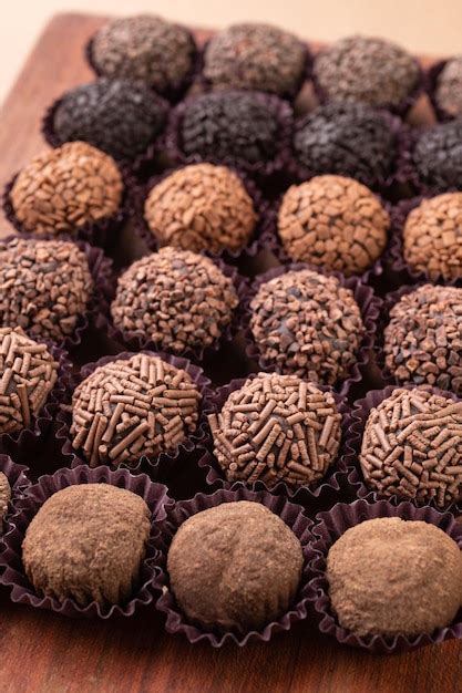 Premium Photo | Typical brazilian brigadeiros various flavors over ...