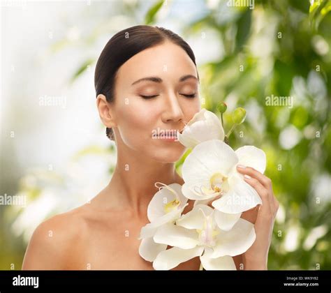 beautiful woman with orchid flower Stock Photo - Alamy