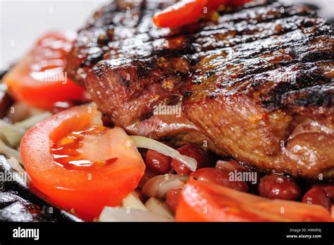 Beef steak with red beans garnish Stock Photo - Alamy