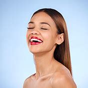 Beauty, woman and red lipstick makeup while laughing with cosmetics on ...