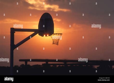 basketball goal at sunset in playground Stock Photo - Alamy