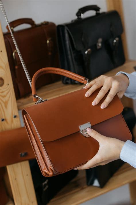 Person Holding Brown Leather Handbag · Free Stock Photo