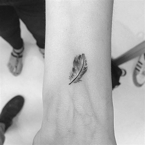 White Feather Tattoos, Feather Tattoo Wrist, Feather Tattoo Design, White Tattoo, Trendy Tattoos ...