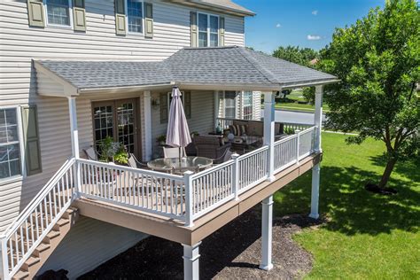 Covered porch with hip-style roof | Porch design, Covered deck designs ...