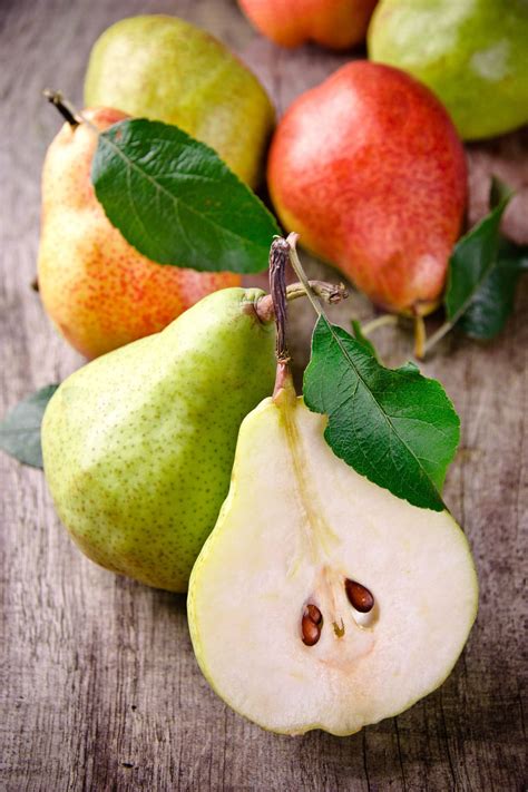 Download Pears On Wooden Table Wallpaper | Wallpapers.com