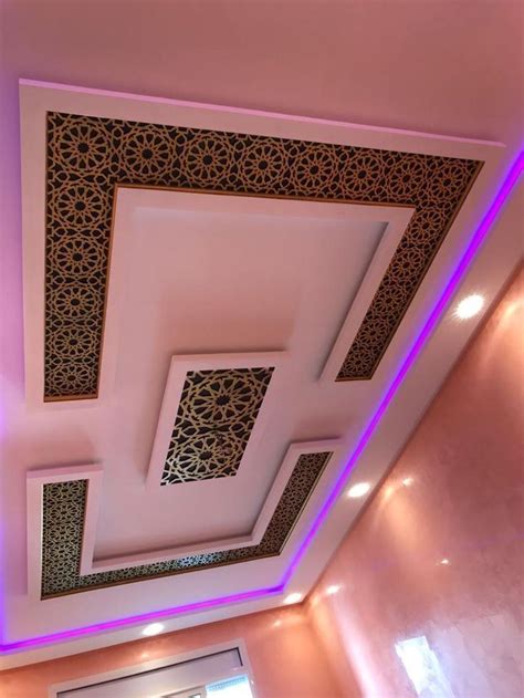 the ceiling in this room is decorated with intricate patterns and lights, along with recessed ...