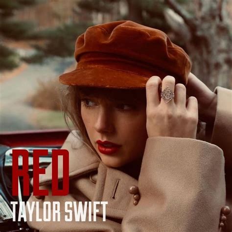 a woman wearing a red taylor swift hat and trench coat with her hand on her head