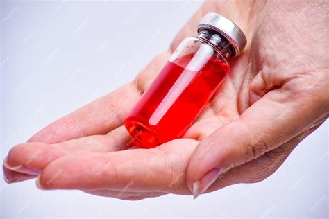 Premium Photo | Woman hand with medical ampoule vial for infection.