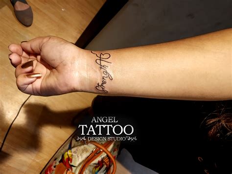 Ek omkar with strength tattoo made on wrist at Angel Tattoo Design ...