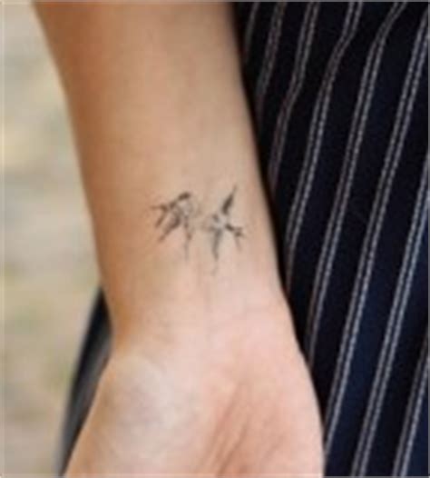 Awesome Five Flying Birds Silhouette Tattoo on Wrist - | TattooMagz ...