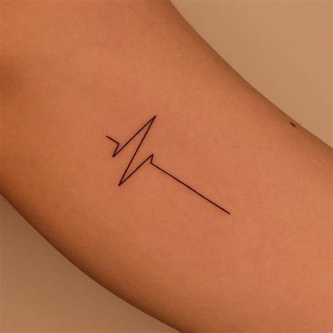 Hearbeat tattoo located on the inner arm, minimalistic