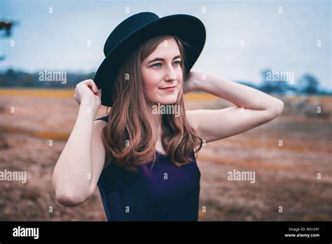 Girl Smiling with Hat Stock Photo - Alamy