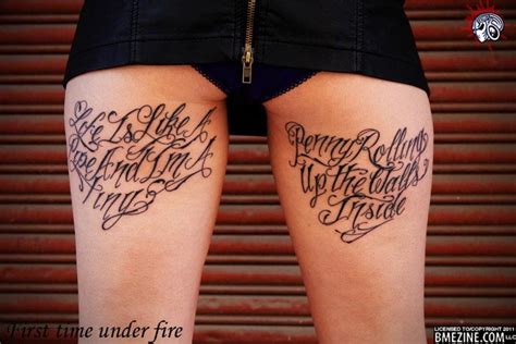 the back of a woman's legs with tattoos on them and words written in cursive writing