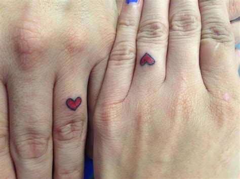 Matching heart tattoo on the ring finger Heart Ring Tattoo, Heart ...