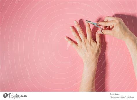 Nail cutter macro detail pink background - a Royalty Free Stock Photo from Photocase