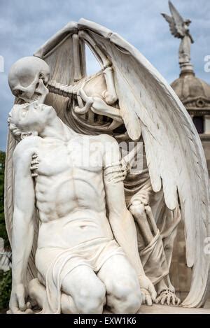 The Kiss of Death statue in Poblenou Cemetery in Barcelona. This marble sculpture depicts death ...