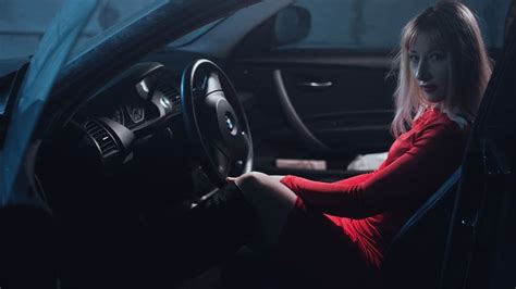 HD wallpaper: woman in red top inside a car, girl in car, in a red dress, behind the wheel ...