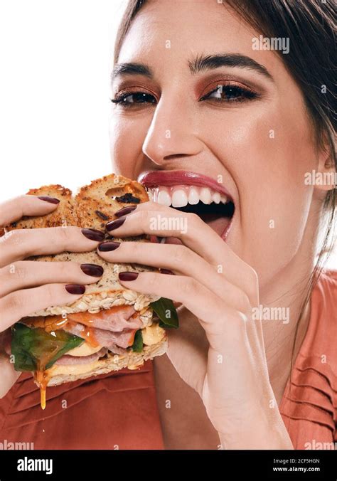 Beautiful Woman holding double sandwich with fresh greenery rye bread and meat Stock Photo - Alamy