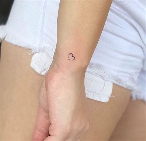 Minimalist tattoo | Tiny heart tattoos, Delicate tattoos for women, Heart tattoo